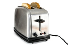 Shiny chrome toaster with two slices of bread