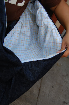 The outside is a soft denim fabric, and the inside has a flannel lining.