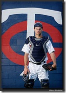 FORT MYERS, FLORIDA - MARCH 3: Catcher Joe Mauer of the Minnesota Twins poses in front of the Minnesota Twins logo at the team's spring training facilities in Fort Myers, Florida on March 3, 2007.   (Photo by Bruce Kluckhohn/MLB Photos via Getty Images)  *** Local Caption *** Joe Mauer