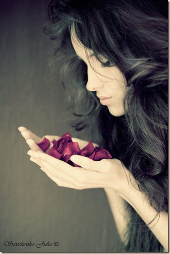 girl holding petals