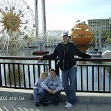 Pretending not to be tired in front of the California Adventure harbor thinger.