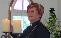 Liz lights candles