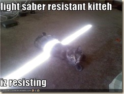 funny-pictures-cat-resists-lightsaber