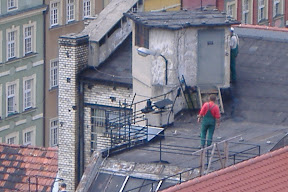 Polish workers on a roof.