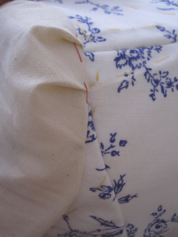 Calico toile sleeve set into the bodice with two pleats. Calico toile sleeve set into the bodice with two pleats.