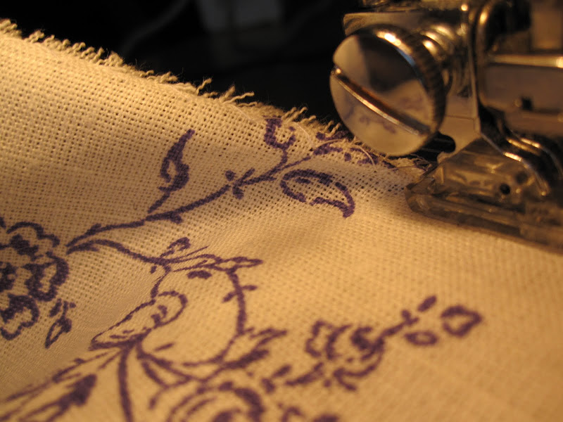 Zig-zag stitching the edge to stop the hem from fraying Zig-zag stitching the edge to stop the hem from fraying
