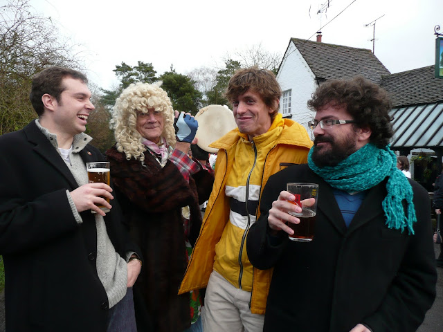 A man in a wig banged a tambourine behind my head