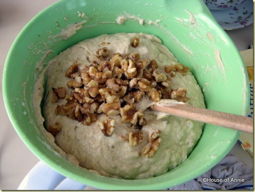adding walnuts to banana nut bread batter