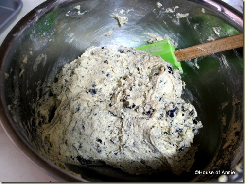 mixing crushed oreos into dirt cookie batter
