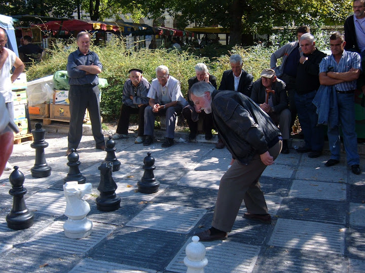 Men Playing Chess in the Center Square by the Bee Festival