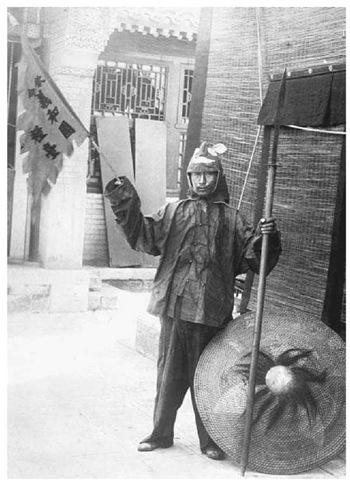 Chinese Rebel During the Boxer Uprising, 1900. A Chinese rebel waves a banner in support of the Boxer Uprising, a violent rebellion against foreign interests in China.