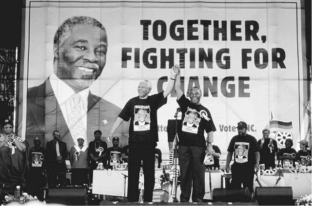 Nelson Mandela and Thabo Mbeki, February 28, 1999. South African president Nelson Mandela (left) stands with Deputy President Thabo Mbeki at a campaign rally in Soweto, South Africa. Mbeki succeeded Mandela as head of the ANC in 1997 and as president of South Africa in 1999. 