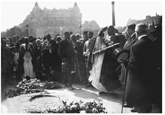 Blaise Diagne in Paris, 1922. West African and French dignitaries place flowers on the tomb of the unknown soldier in Paris. The Senegalese statesman Blaise Diagne stands at the center with hat in hand.