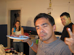 Felix throwing gang signs in the kitchen with Carolyn and Martin
