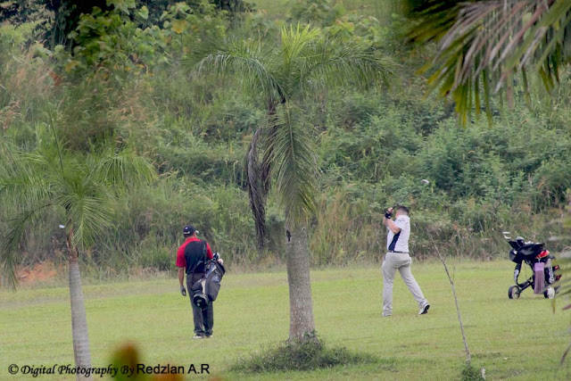 Golfer taking a swing