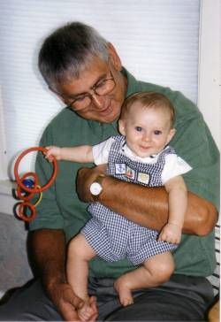 George Madzia with a grandchild in 1999