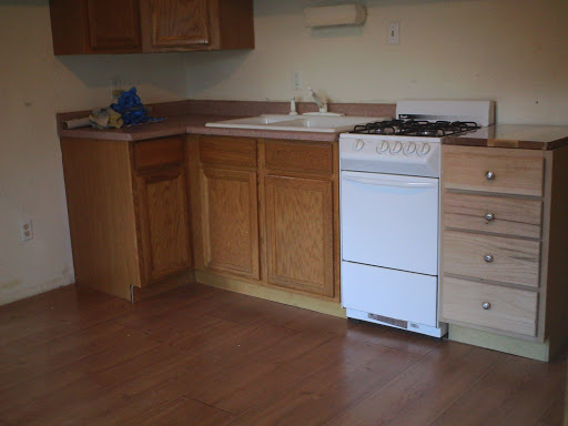 kitchen with gas stove and garbage