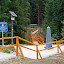 Triple point (the monument). We are standing in the Czech Republic, accross the yellow handrail is Poland. The bridge and the walkway lead to Slovakia.