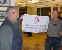Fall Fleet Fling and skippers' meeting / Dave Tarson (right) hoilds 2nd place Bistate award to Excalibur