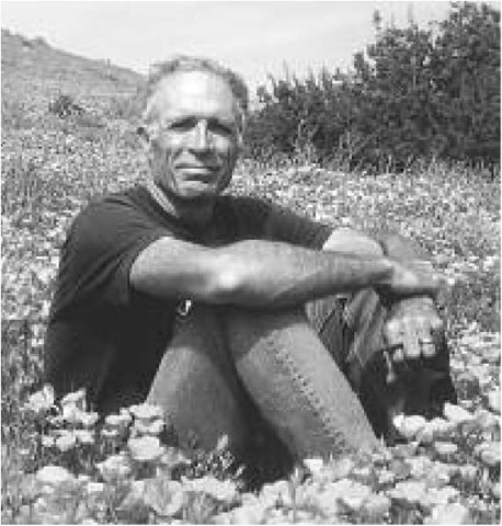 Arthur Sylvester sitting in a field of flowers in California 