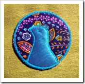 peacock brooch alone