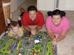 Playing "cars on the road" with Daddy and Mom-Mom