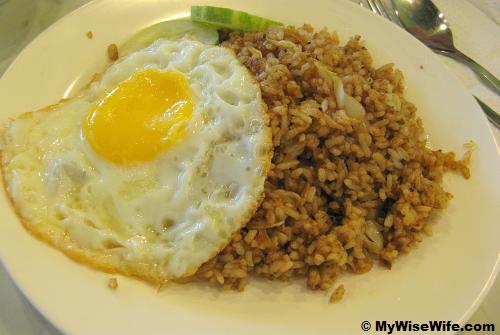 Salted fish fried rice with a bull-eyed egg and cucumber Salted fish fried rice with a bull-eyed egg and cucumber