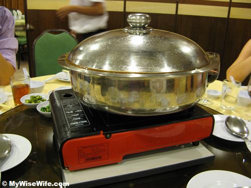 A huge basin on gas stove A huge basin on gas stove