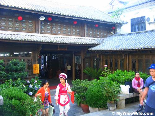 Our hotel reception with plenty potted plants symbol of Bai community and Dali houses