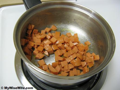 Saute the diced frankfurter Saute the diced frankfurter