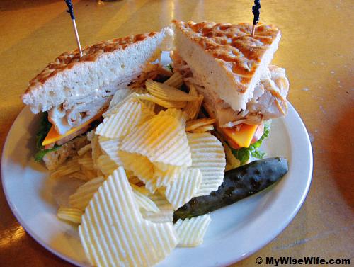 Turkey & Cheese Sandwich - sliced turkey piled high with mustard, lettuce, tomatoes and plenty of chips Turkey & Cheese Sandwich - sliced turkey piled high with mustard, lettuce, tomatoes and plenty of chips