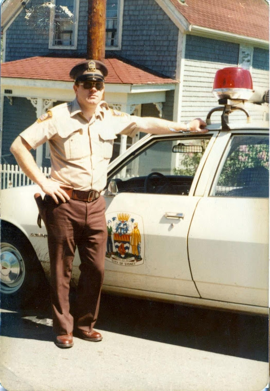 My father with a new police car in 1978.