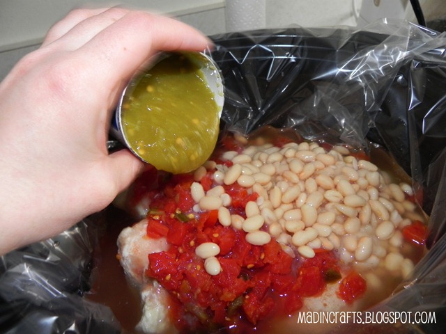 hand pouring chilies into a crockpot
