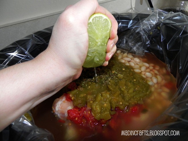 hand squeezing lime into a crockpot