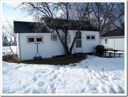 The cabin surrounded by snow