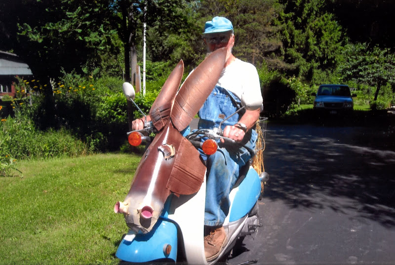 Grandpa on his tricked out scooter Grandpa on his tricked out scooter