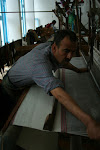 Weaver at work making fabric for Berber jackets, Cooperative des Tisserands el-Faouz, Beni Khiar, Tunisia