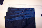 The ribbon pinned to the hem
