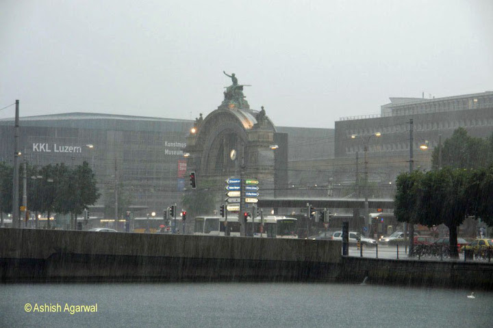 Photo: Sheer rain drenching KKL and the Railway Station in Luzern in Switzerland
