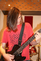 Emo Kid play's guitar.....