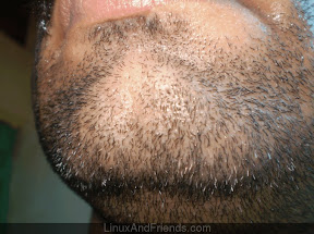 Wet face liberally with warm water.