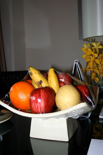 a bowl of fruit on a table