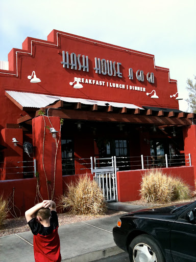 a red building with a sign on it