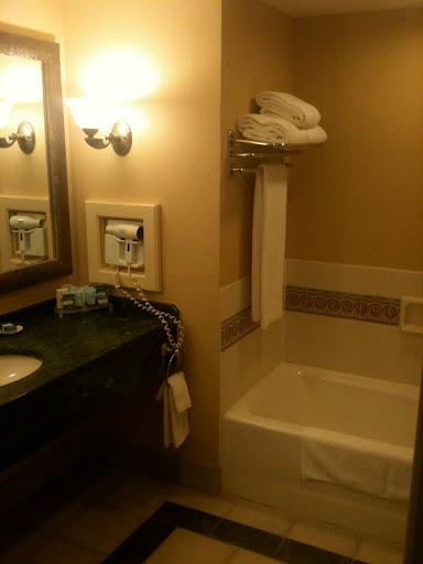a bathroom with a sink and a towel rack