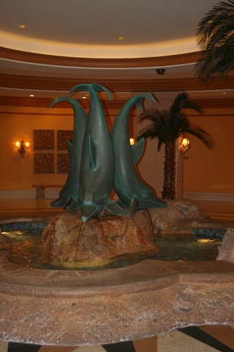 a fountain with dolphins in the middle