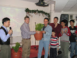 the Yunghe church giving a kumquat tree to the Ankeng church plant group
