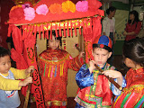 Joshua carrying a “bride” in a presentation at school