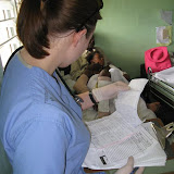 Checking a patient's chart for their medication and what needed to be done.