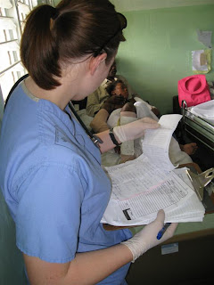 Checking a patient's chart for their medication and what needed to be done.