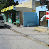 On our way to Jimani with a team of 8 to help earthquake victims. This is a random town with a store that had a toilet.